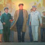 Kim Il Sung sporting a hat in subway mural.