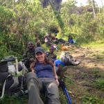 Collapsed on Nyiragongo during a short break on the way up.  The cook and porters behind me.