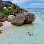 Kayaking in a clear kayak at Anse Source d'Argent beach.