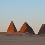 Pyramids next to Jebel Barkal at sunset.