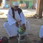 Breakfast in Kerima. This kind man brought over a watermelon for me and stated carving it up.